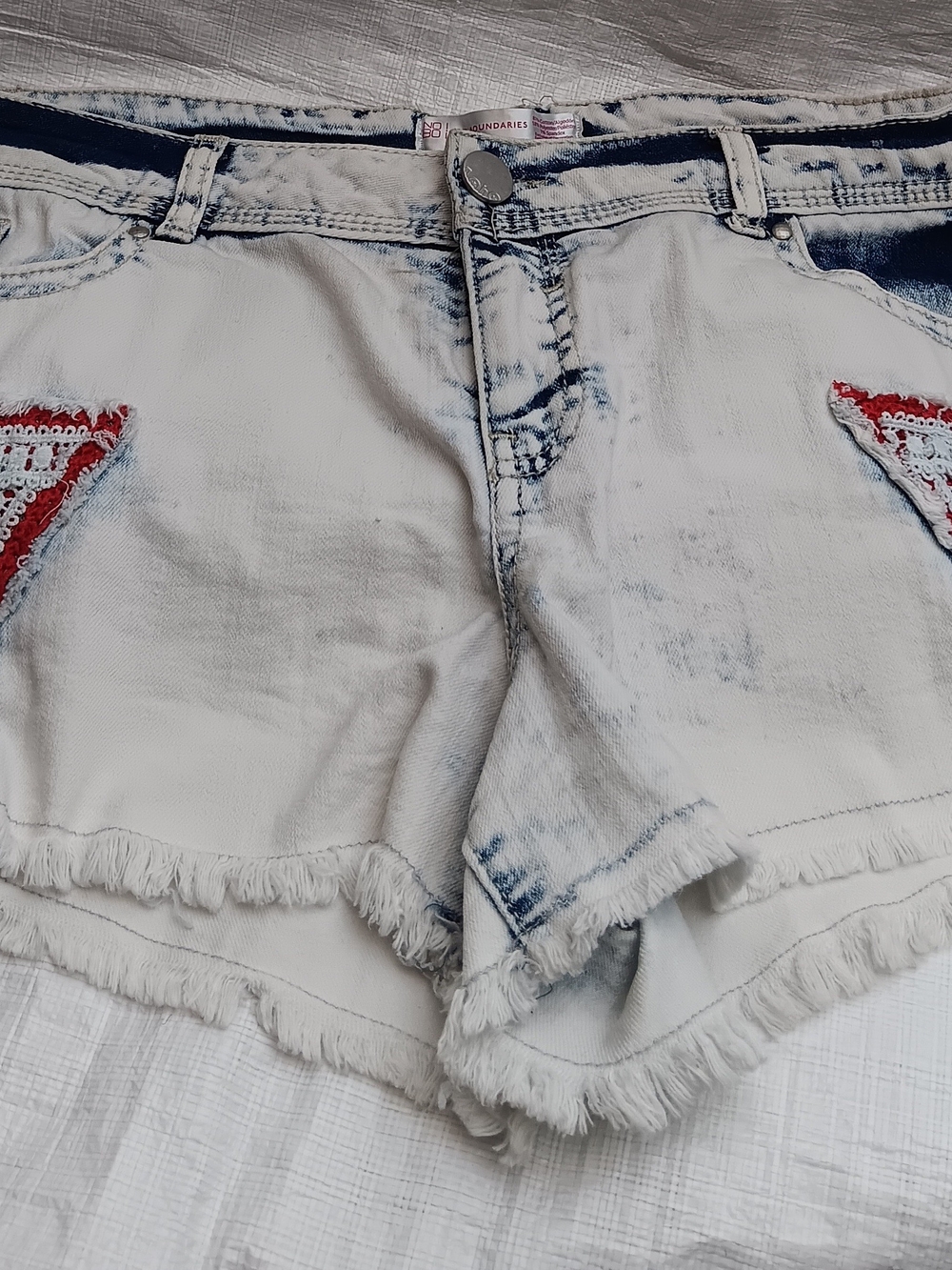 No Boundaries , Women’s White Acid-Wash Denim Fringe Shorts with Red Accent